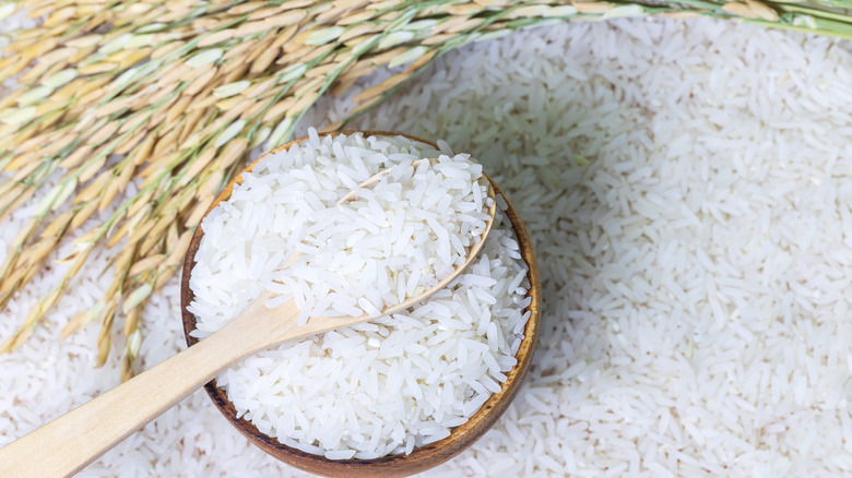 Pile of rice wooden spoon bowl