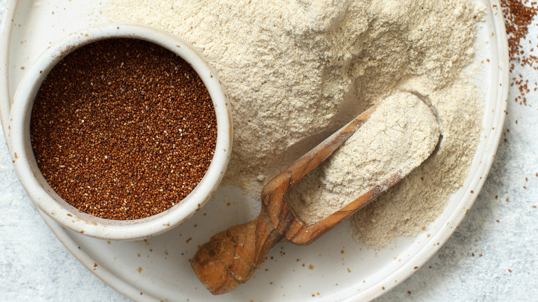 Teff grains and flour wooden scoop