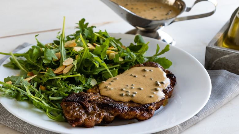 Steak with green peppercorn sauce