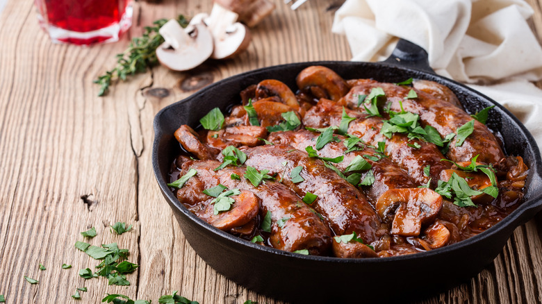 sausages cooking in mushroom gravy