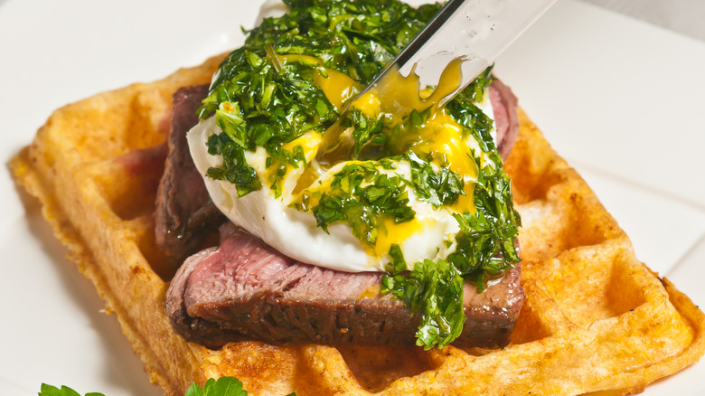 steak and eggs on waffle