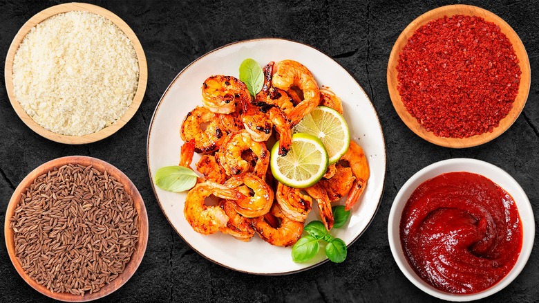 Plate of grilled shrimp with seasonings