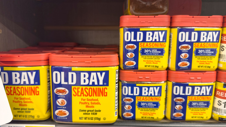 Several containers of Old Bay seasoning on a shelf