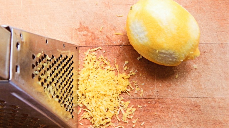 Lemon with grater and zest