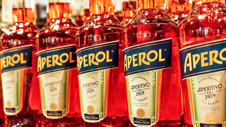 bottles of Aperol on shelf