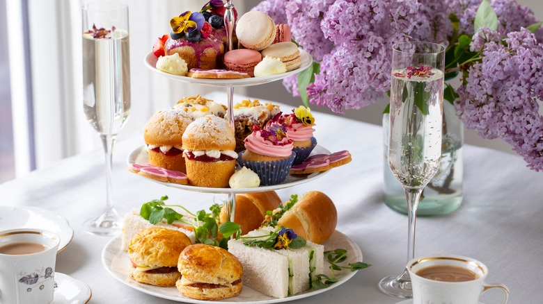 afternoon tea selection on table with flowers