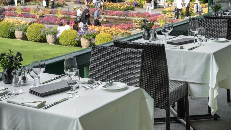 dining tables and chair overlooking Butchart Gardens