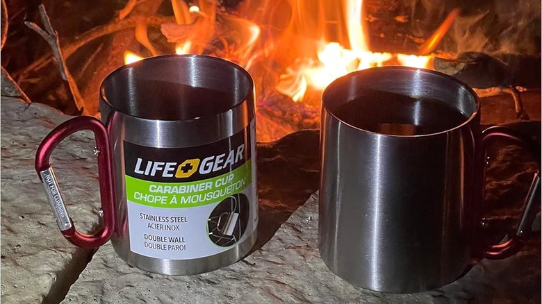 Two Life Gear Stainless Steel Mugs in front of a campfire