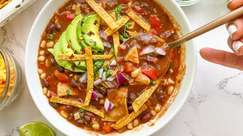 Vegetable tortilla soup in bowl