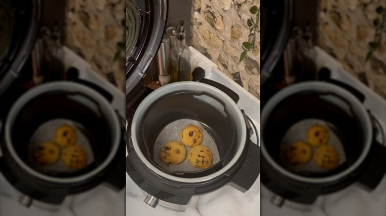 Chocolate chip cookies in an air fryer basket