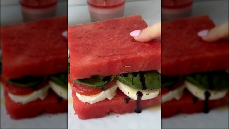 Watermelon sandwich with mozzarella, tomato, and basil