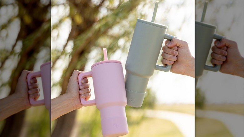 hand holding Simple Modern Tumbler