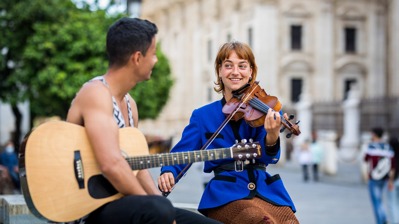 Couple playing street music