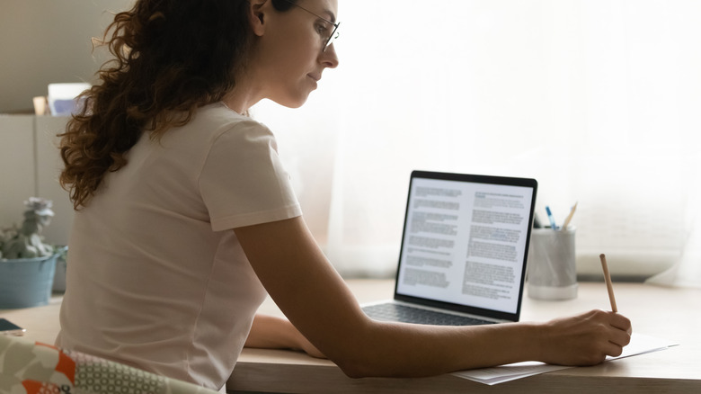 Woman researching on laptop