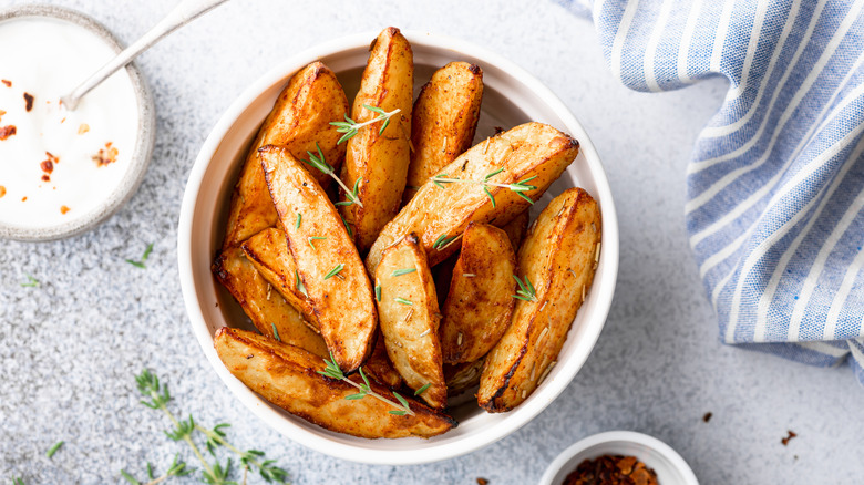 fried potato wedges sauce herbs