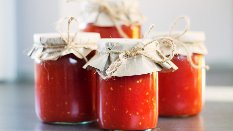 Four jars of tomato sauce