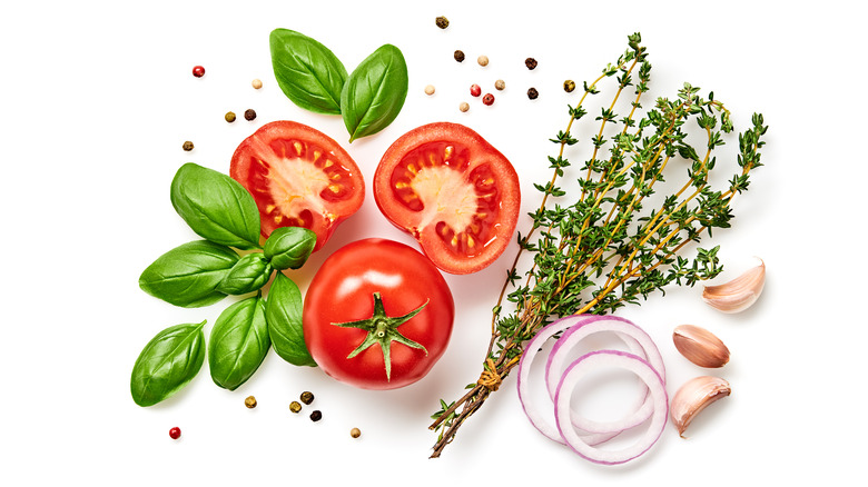 Tomatoes with basil and rosemary