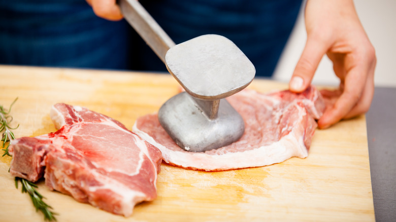 Beating steak with mallet