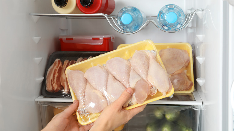 Packaged chicken in a refrigerator