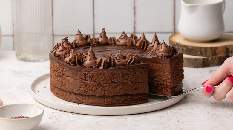 Cut slice of mousse cake 