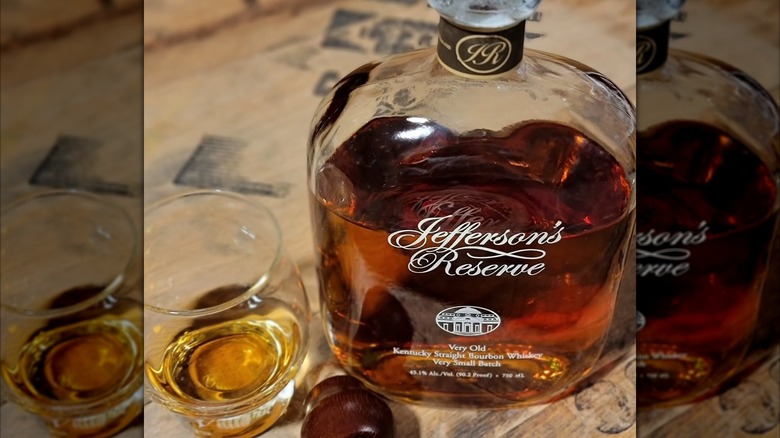 Bottle on Jefferson's Ocean with a glass on the side