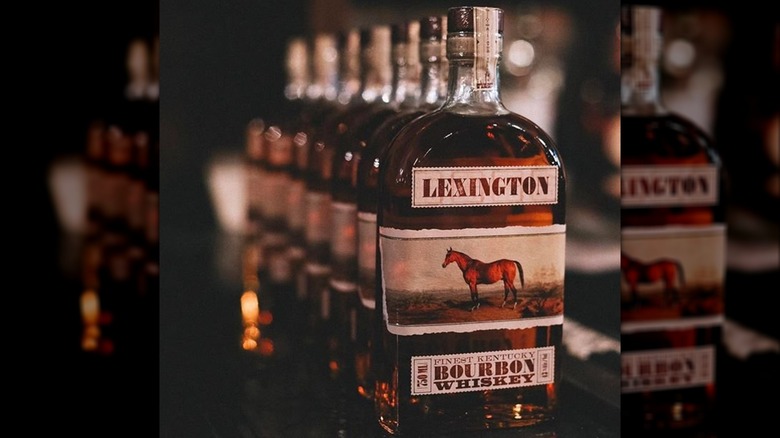 A row of Lexington bourbon bottles on a counter