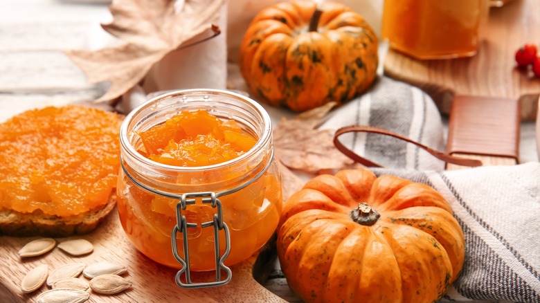 Doce de Abóbora with pumpkins sitting next to it