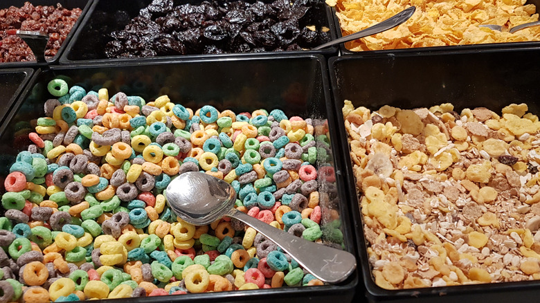 Sugary cereal options in trays at a buffet