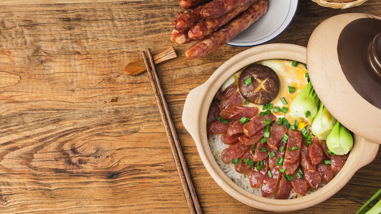 clay pot rice  on wood board