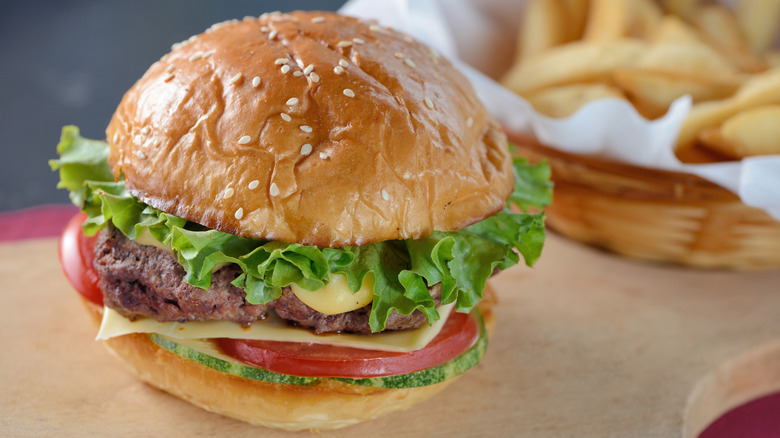 burger with lettuce, tomato, and cheese