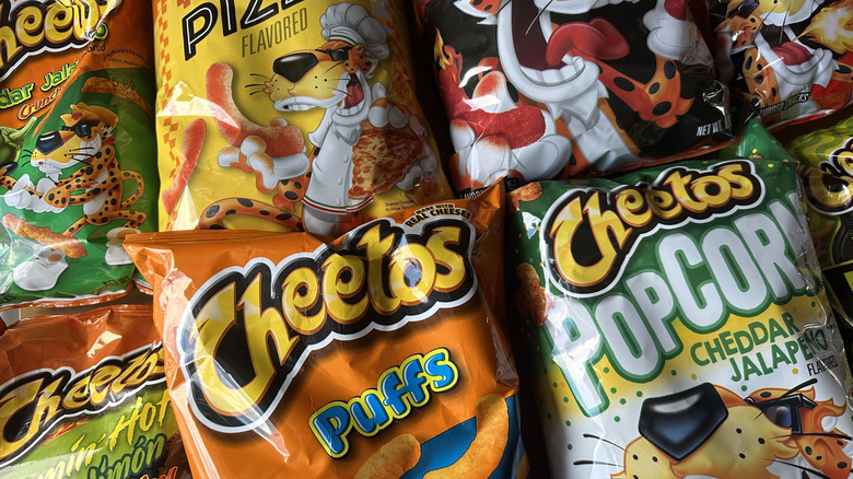 Variety of Cheetos bags arranged on table