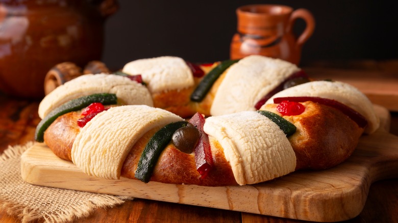 Rosca de reyes bread on a wooden board