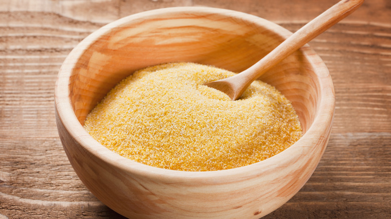 wooden bowl of cornmeal 