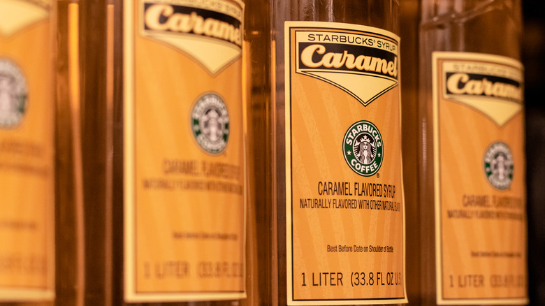 Starbucks caramel coffee syrup bottles lined up