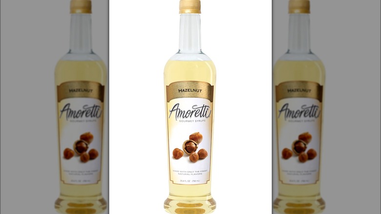 Amoretti hazelnut coffee syrup bottle against white background