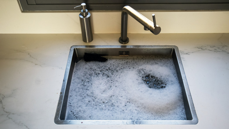 An overflowing kitchen sink