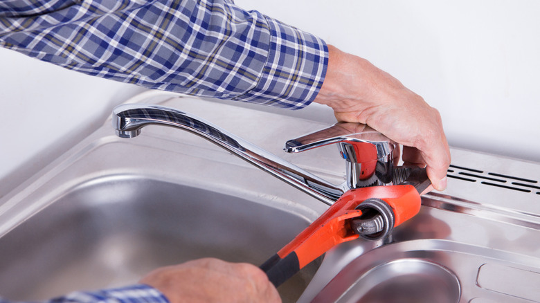 Tightening a kitchen faucet