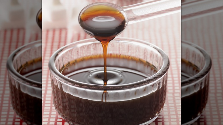 Caramel being poured into glass dish