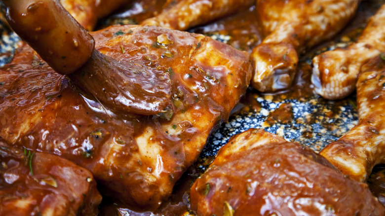 Meat being rubbed with marinade