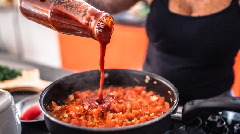 Woman prepping hot sauce