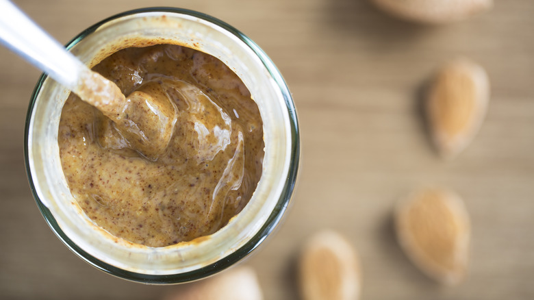 Open jar of almond butter