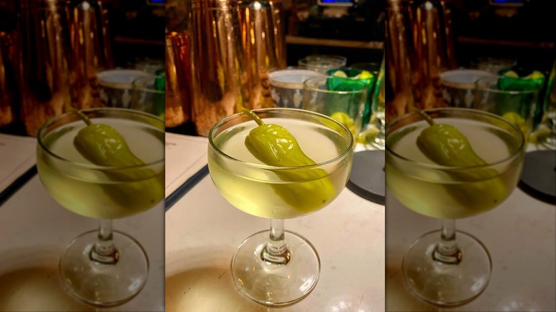 Pepperoncini martini in glass on white bar