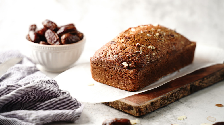 Date loaf on parchment-lined wooden board
