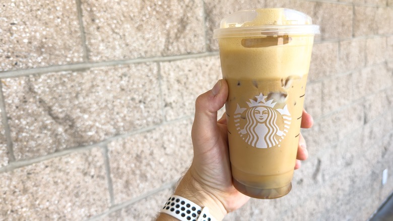 hand holding iced Starbucks drink