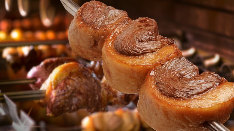 Skewer of picanha being grilled 