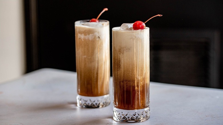 Two Colorado Bulldog cocktails topped with cherries