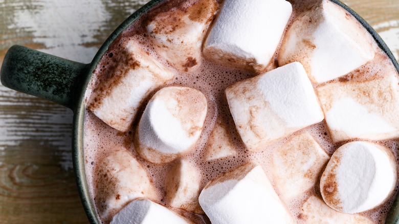 Marshmallows floating in mug of hot chocolate