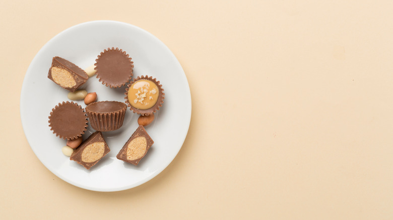 Peanut butter cups with nuts on plate