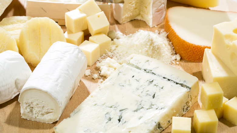 Different cheeses on a board.