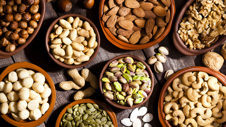 Assortment of nuts in bowls.